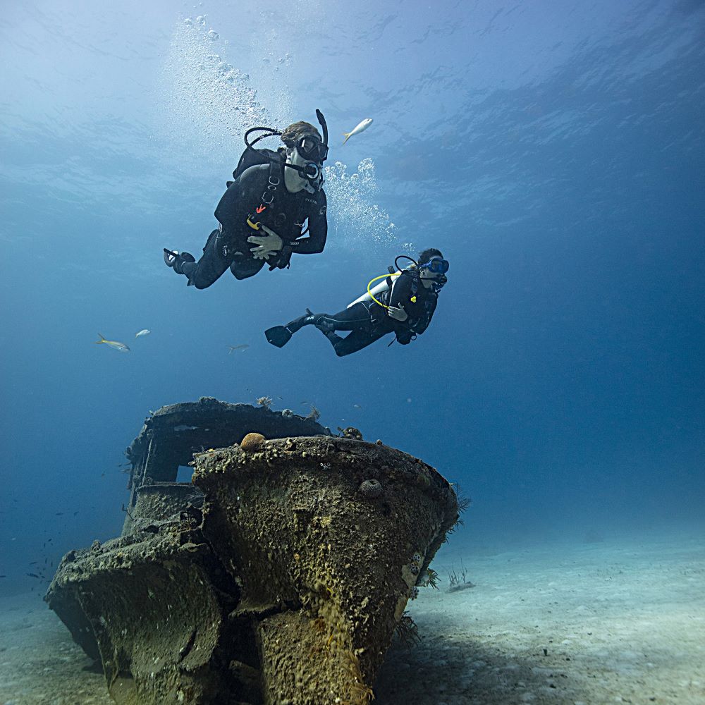Scuba students working together in shallow water