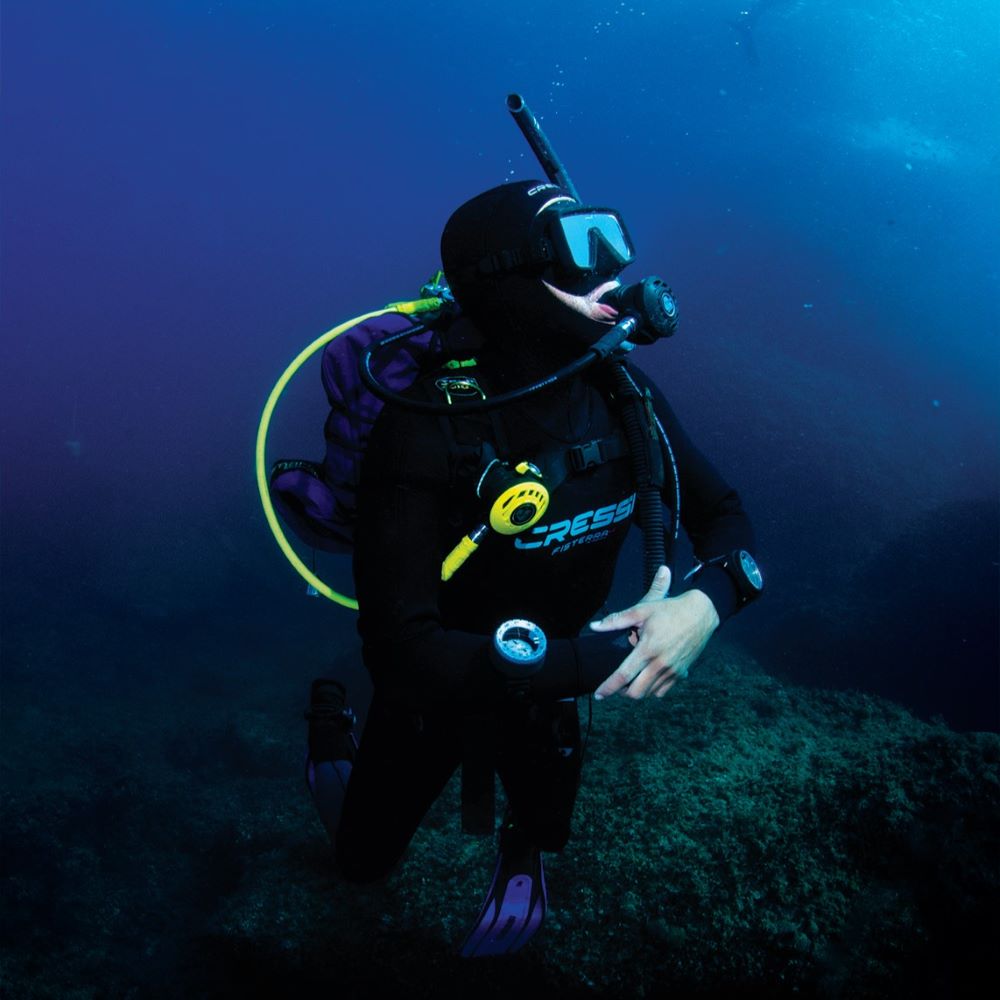 Instructor and student communicating underwater