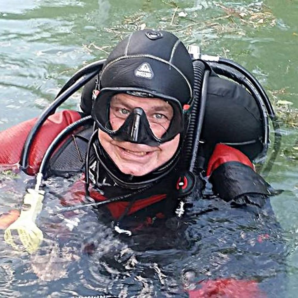 Student diver listening carefully during pool instruction