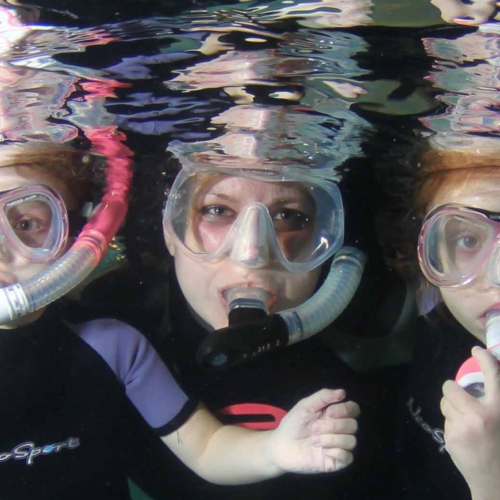 New scuba diver practicing in shallow water